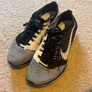 Black and white fly knit racers